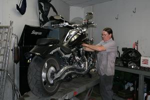 Staff Working on Motorcycle